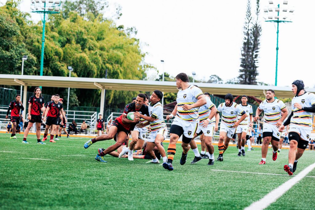 Rugby players in action, capturing the intensity of a match on an outdoor field.